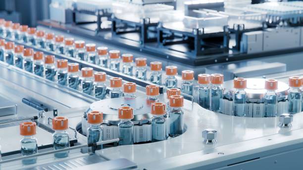 Pharmaceutical tablets moving through a manufacturing line